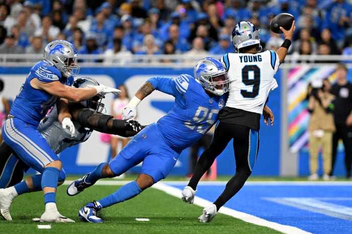 Oct 8, 2023; Detroit, Michigan, USA; Detroit Lions defensive end Romeo Okwara (95) nearly sacks Carolina Panthers quarterback Bryce Young (9) in the end zone in the third quarter at Ford Field. Okwara forced Young into an intentional grounding penalty on the play.